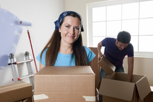 Packed storage boxes and wrapped furniture inside a storage unit