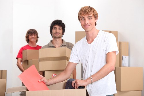 Moving team handling boxes and furniture for removals and storage in Stpaulscray